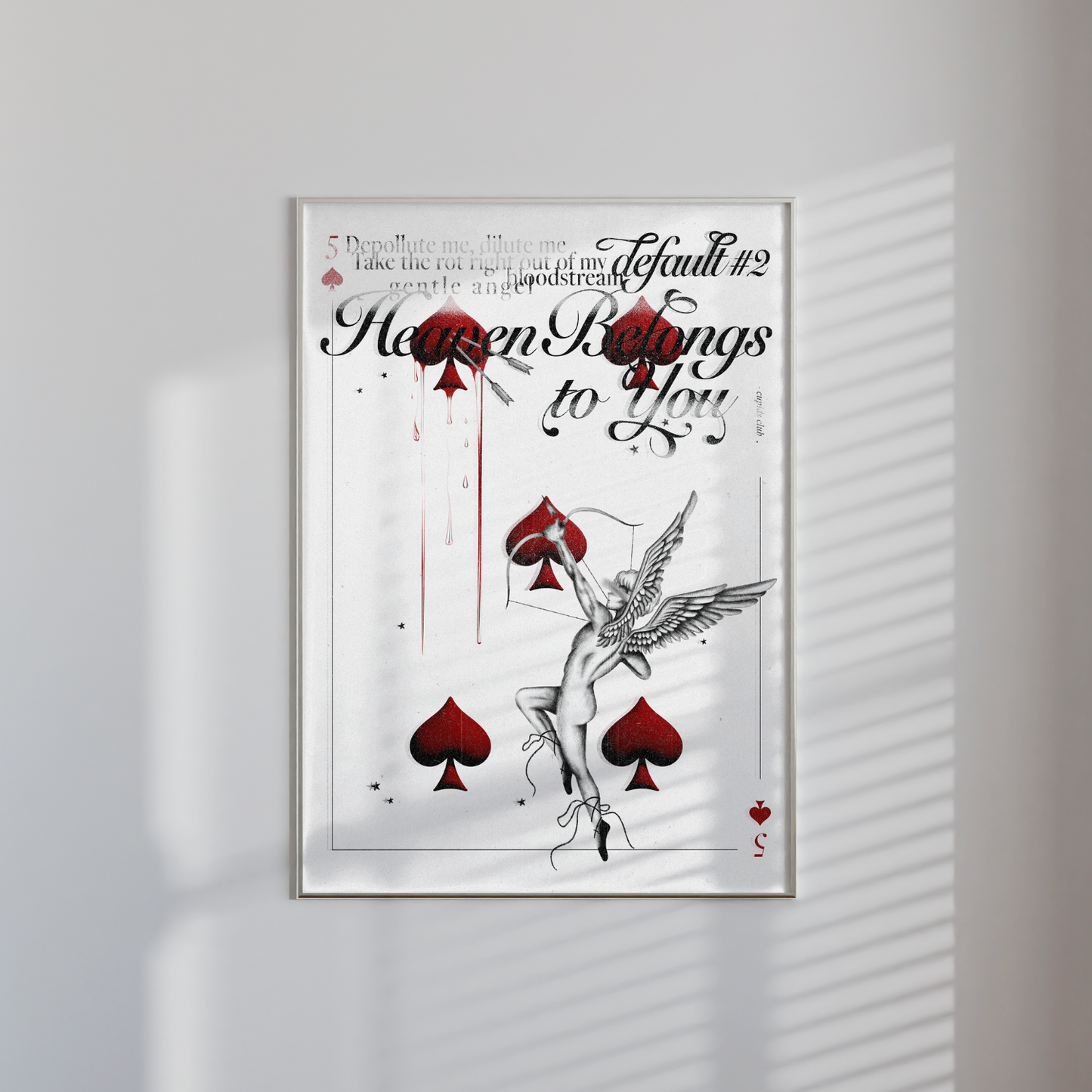 Framed Heaven Belongs to You print hung up on a wall featuring Cupid arrow, spades card, faded typography and textured background.