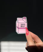 100% MILF Sticker in sunlight next to a hand for size comparison