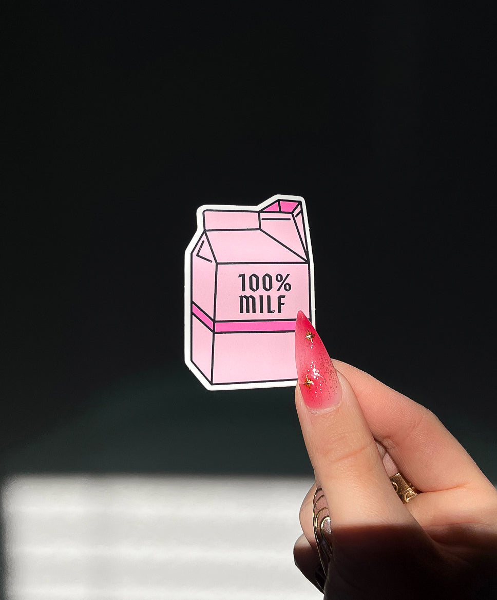 100% MILF Sticker in sunlight next to a hand for size comparison