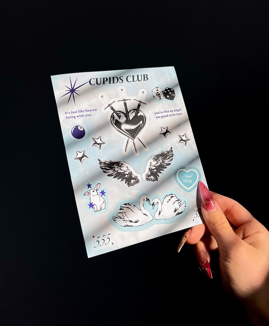 Angled view of Angel Baby sticker sheet in sunlight