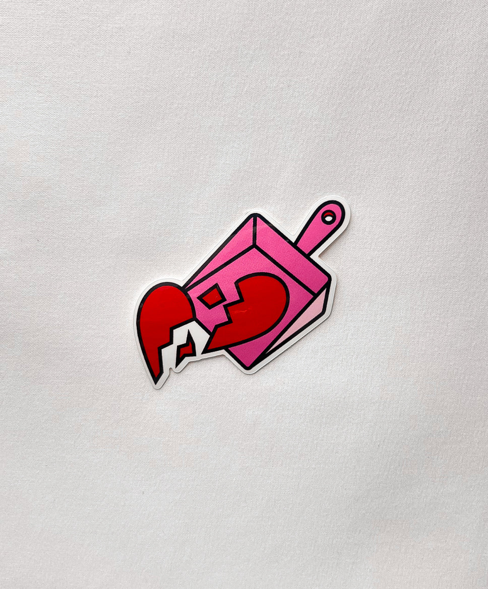 Broken Hearts Sticker featuring a red broken heart and pink dust pan