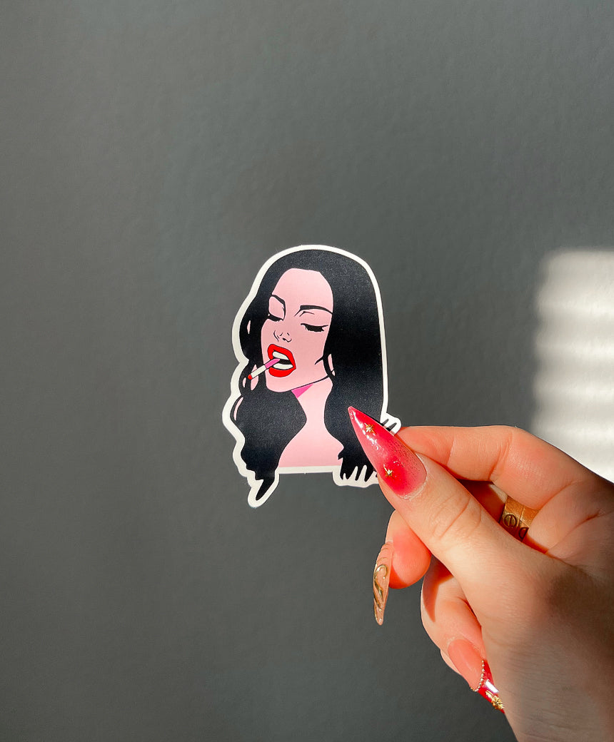 CupidsCrush Sticker next to a hand for size comparison