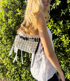 Jiji in Neutrals crochet shoulder bag with black and white ribbon accents