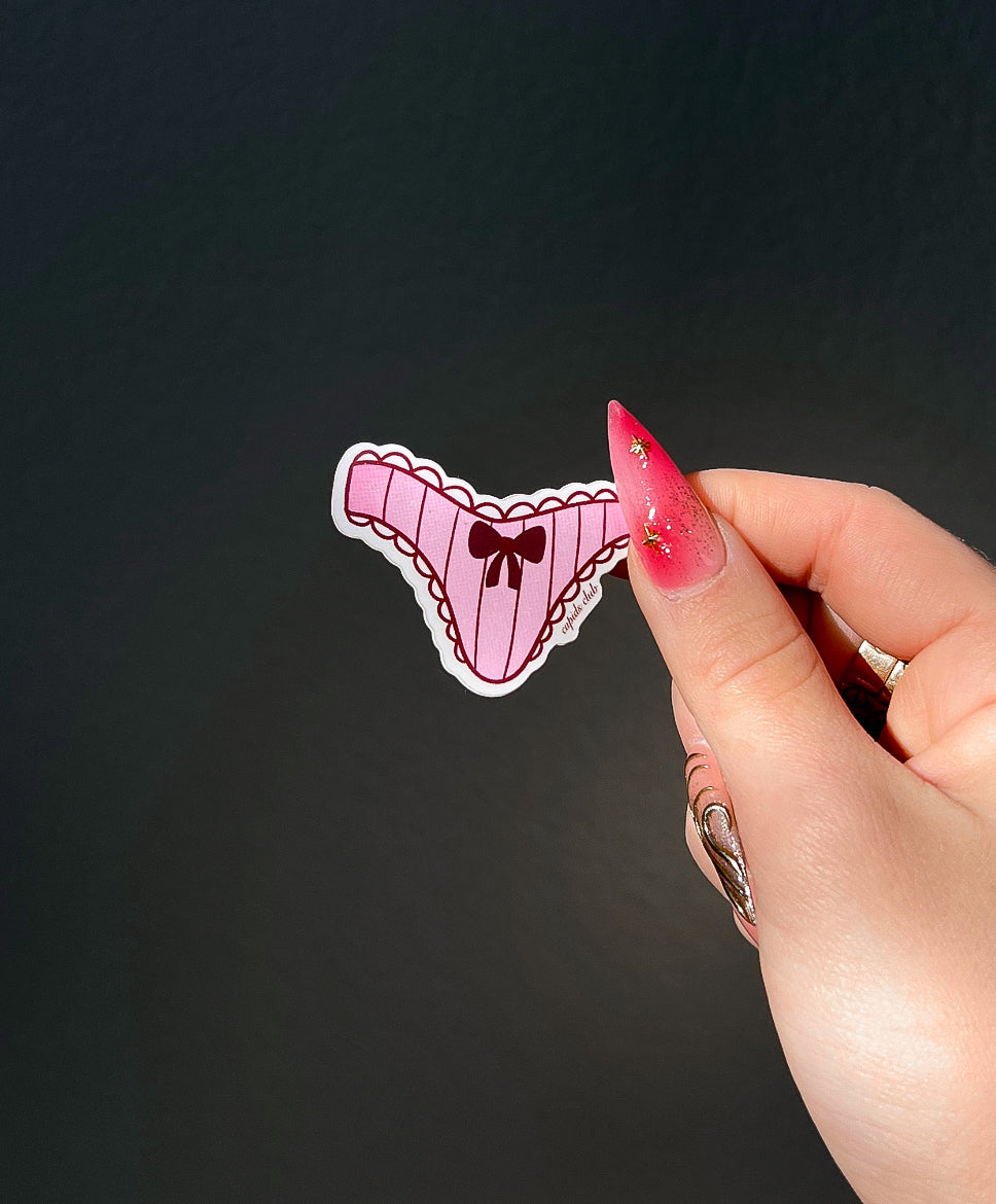 Underwear sticker of the Lingerie Sticker Set next to a hand for size comparison
