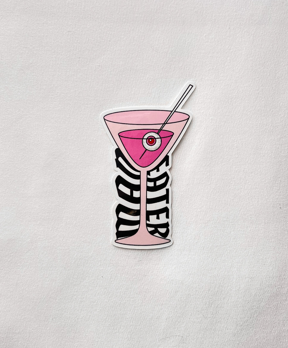 Man Eater Martini Sticker featuring a pink drink martini glass and an eyeball on a toothpick