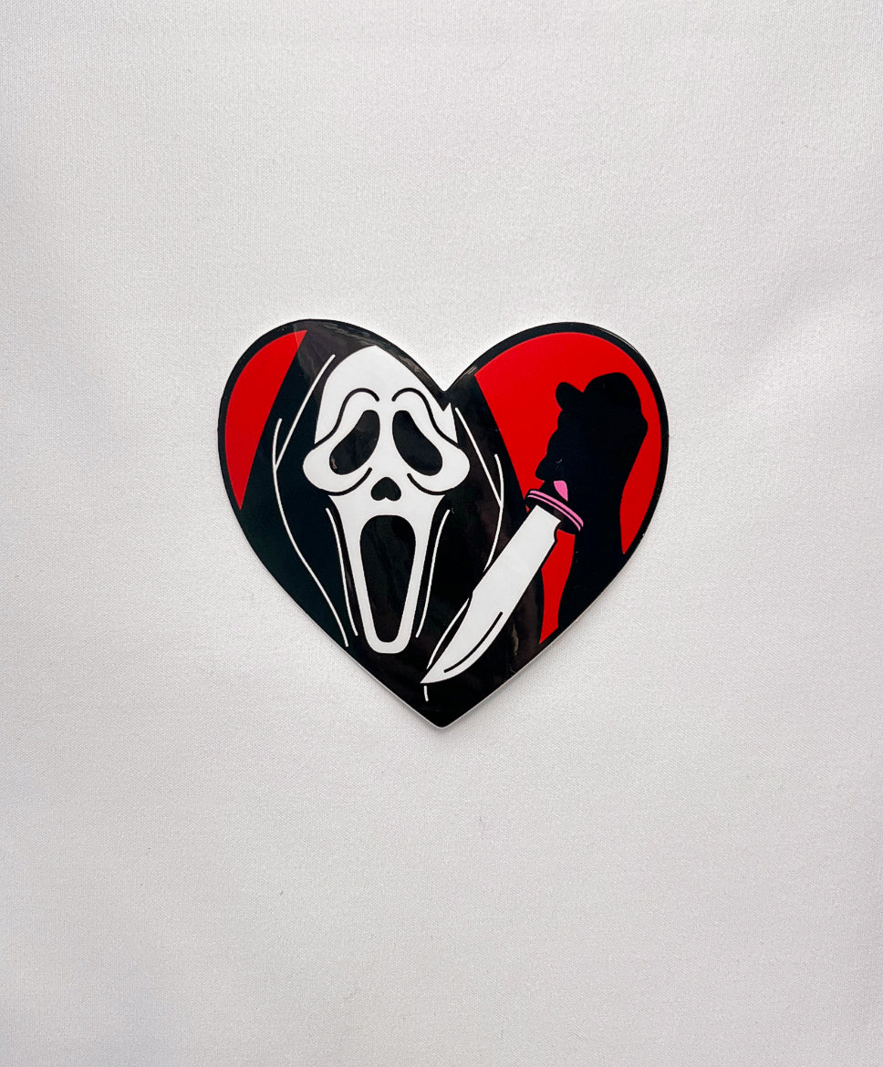 Masked Heart Sticker inspired by Ghost Face. Holding a knife in a heart design.