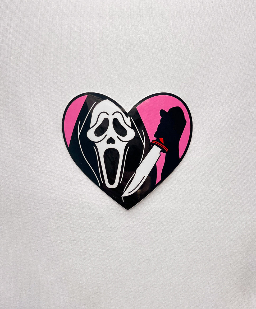 Masked Heart Sticker inspired by Ghost Face. Holding a knife in a heart design.