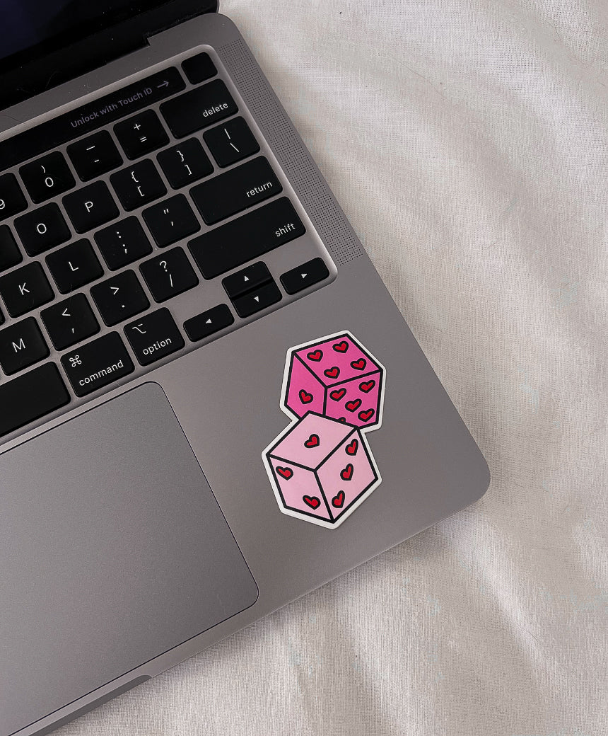 Roll the Dice Sticker on laptop computer for size comparison