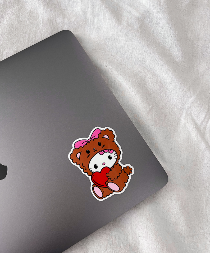 Teddy Bear Kitty Sticker on a laptop computer for size comparison