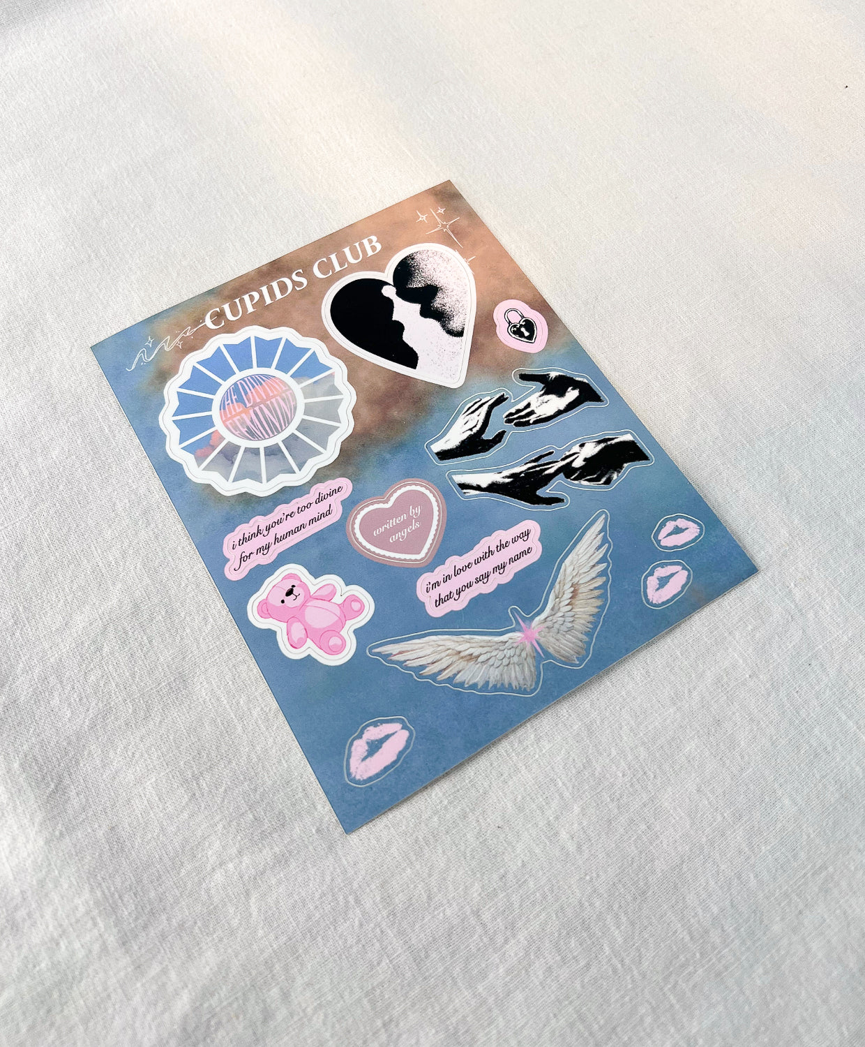 Divine Feminine sticker sheet featuring Mac Miller, Creation of Adam, angel wings, teddy bear, and pastel cloud background.