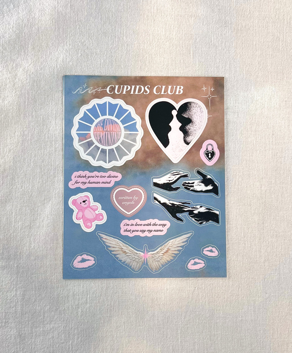 Straight view of Divine Feminine stickers featuring Mac Miller, Creation of Adam, angel wings, teddy bear, and pastel cloud background.